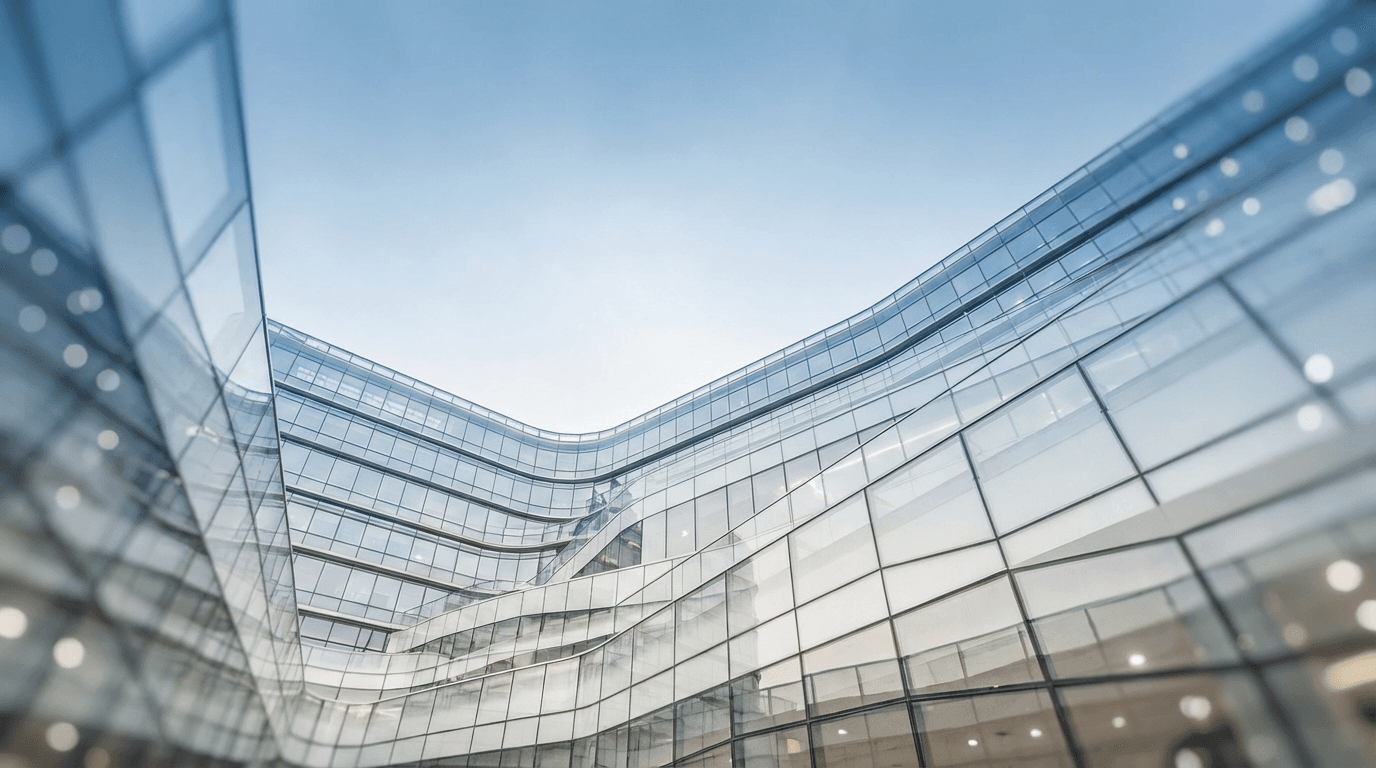 Glass and steel high-rise facade with cool reflections